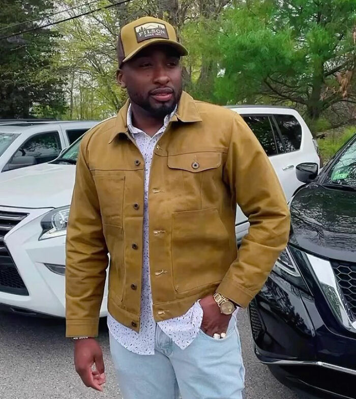 A stylish dad standing next to cars, after a child support court case backfired badly. A stylish dad standing next to cars, after a child support court case backfired badly.