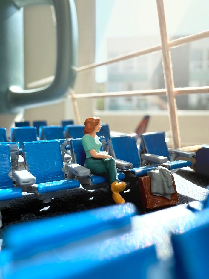 Artist Derrick Lin crafts intricate diorama sets, depicting a woman waiting in an airport terminal.