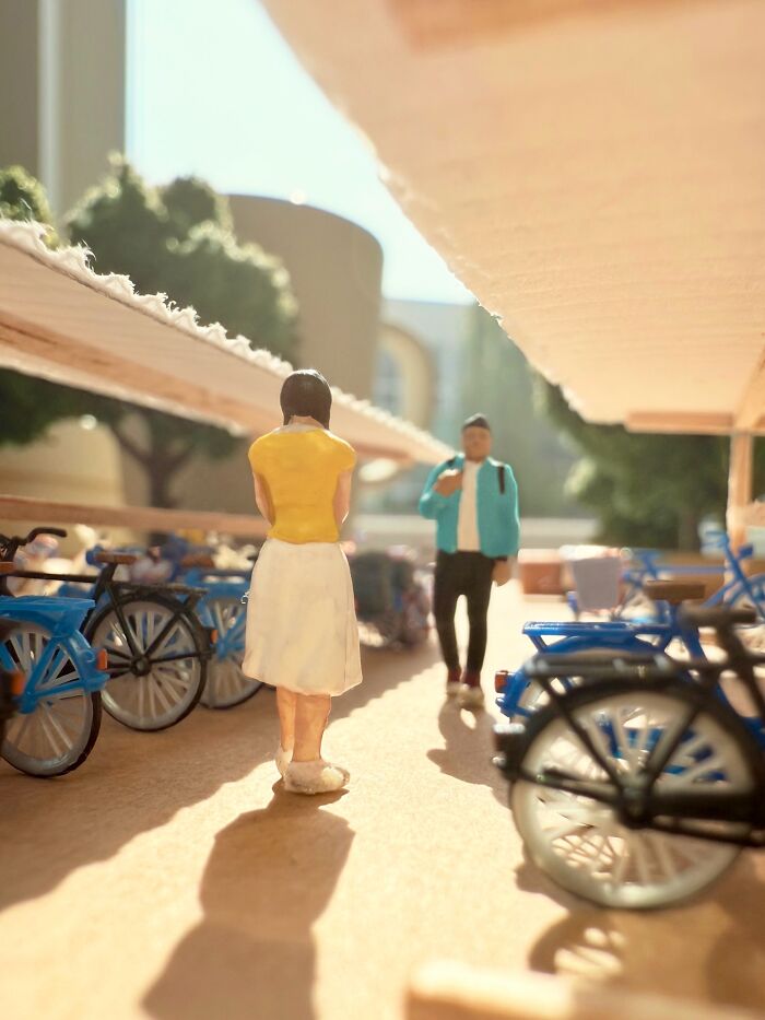 Artist Derrick Lin turns his office desk into intricate diorama sets, depicting a market scene with bicycles.