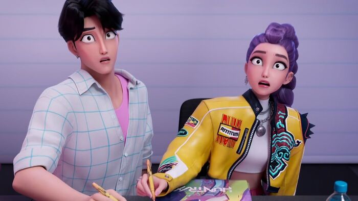 Two animated characters, a man and a woman, with wide eyes and shocked expressions, reflecting hilarious movie details.