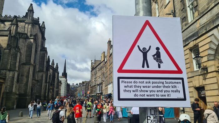 Absurd signs: A street sign warning against asking Scotsmen what they wear under their kilt.