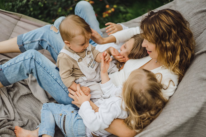 A happy mother and her children relaxing in a hammock, contrasting with the pushy MIL. A happy mother and her children relaxing in a hammock, contrasting with the pushy MIL.