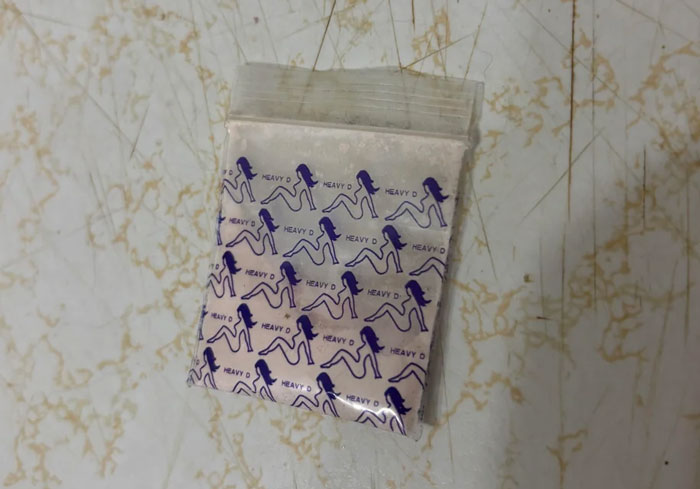 Close-up of a small plastic bag filled with white mystery powder, found in a fiancé's pocket. Close-up of a small plastic bag filled with white mystery powder, found in a fiancé's pocket.