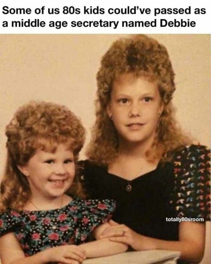 Two young girls with voluminous 80s hairstyles, a Gen X meme about 80s kids' looks.