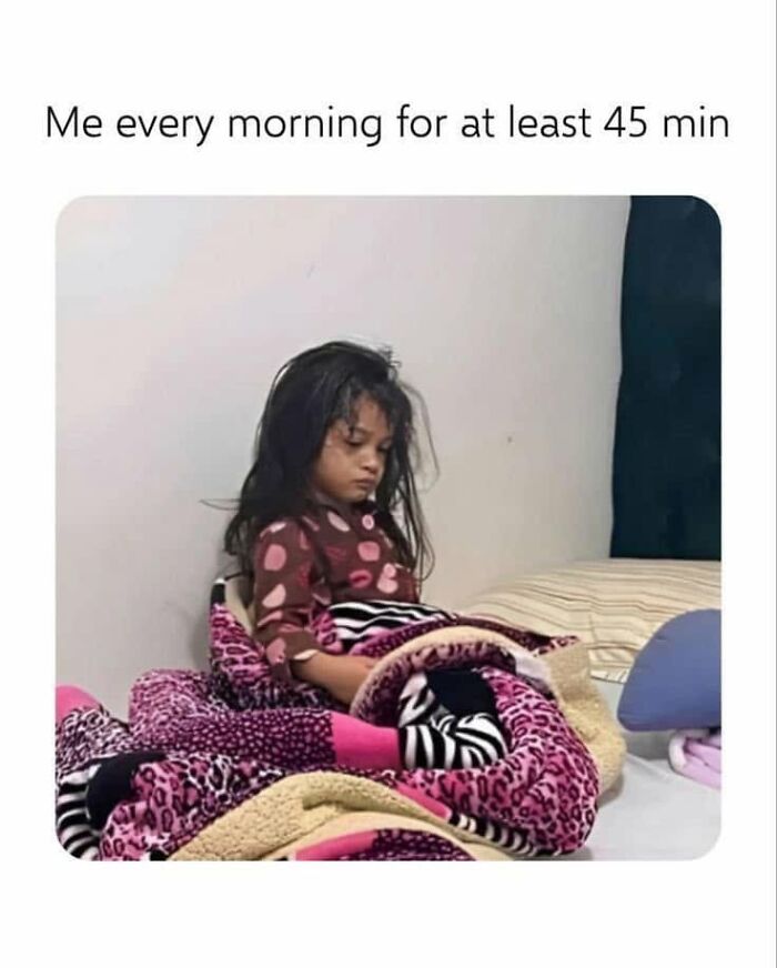 Funny post of a sleepy child wrapped in a blanket, depicting the struggle of mornings, a funny post about being a woman.