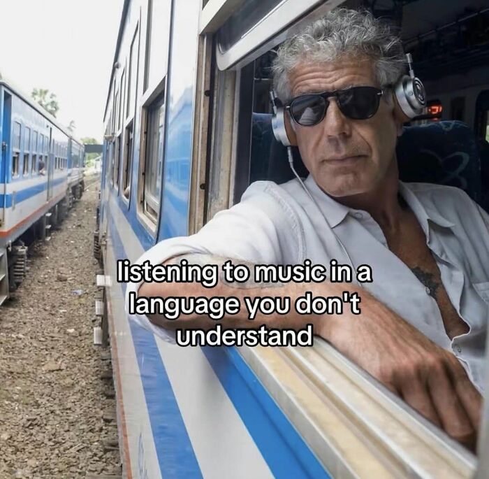 Funny post about a man on a train listening to music in an unknown language, relatable to funny posts about being a woman.