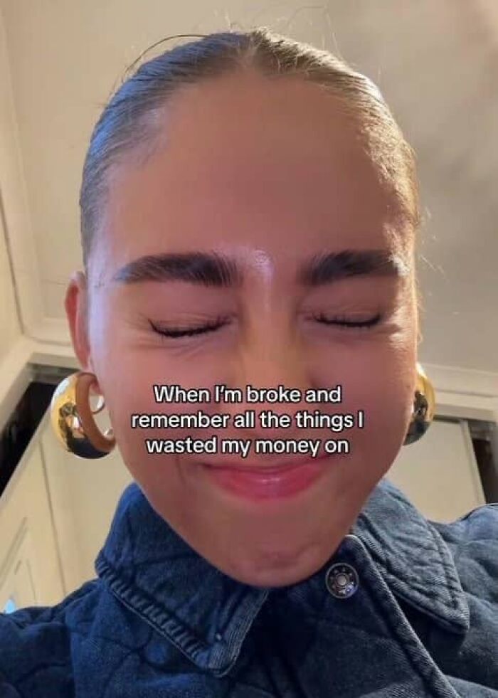 Funny post: Woman with closed eyes and large earrings, regretting wasted money. Captures the funny side of being a woman.