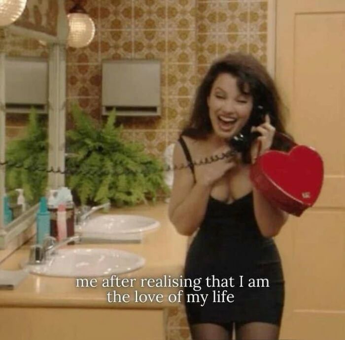 Funny posts about being a woman: Fran Fine from The Nanny excitedly talking on the phone, holding a heart-shaped box.