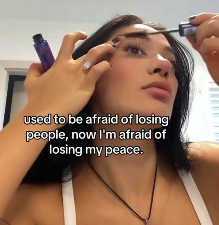Funny post about being a woman, with a woman applying mascara, reflecting on peace and losing people.