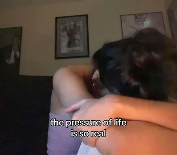 A person hunched over with their face hidden and text the pressure of life is so real. Funny posts about being a woman.