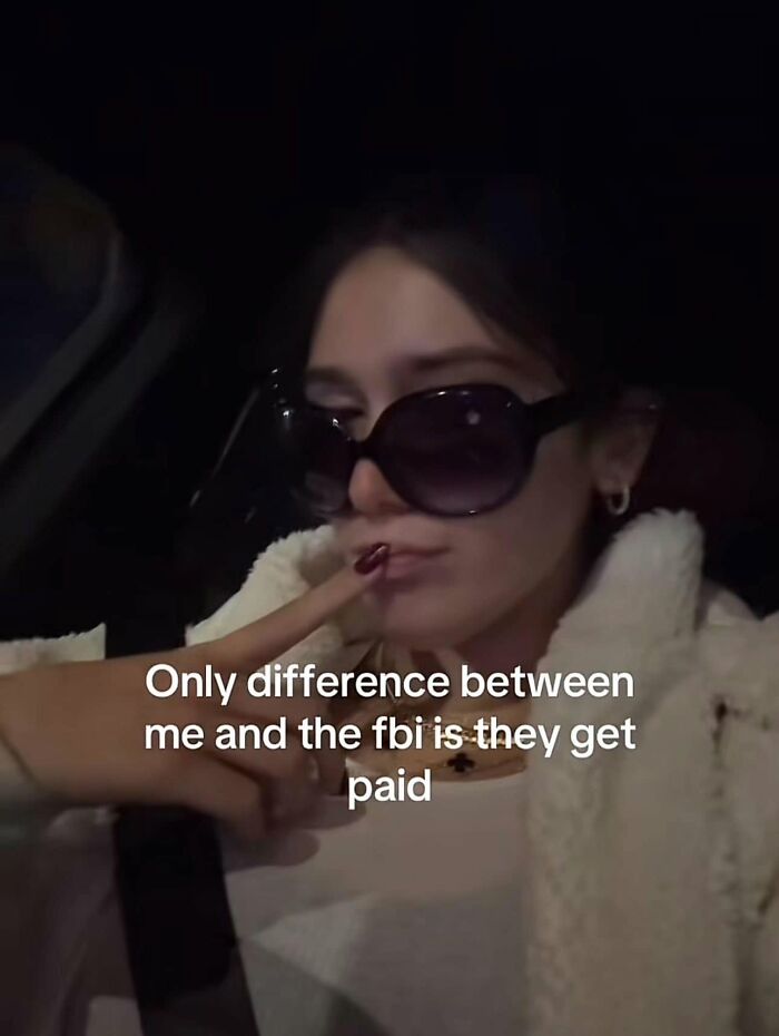 A woman wearing sunglasses with text Only difference between me and the fbi is they get paid. Funny posts about being a woman.