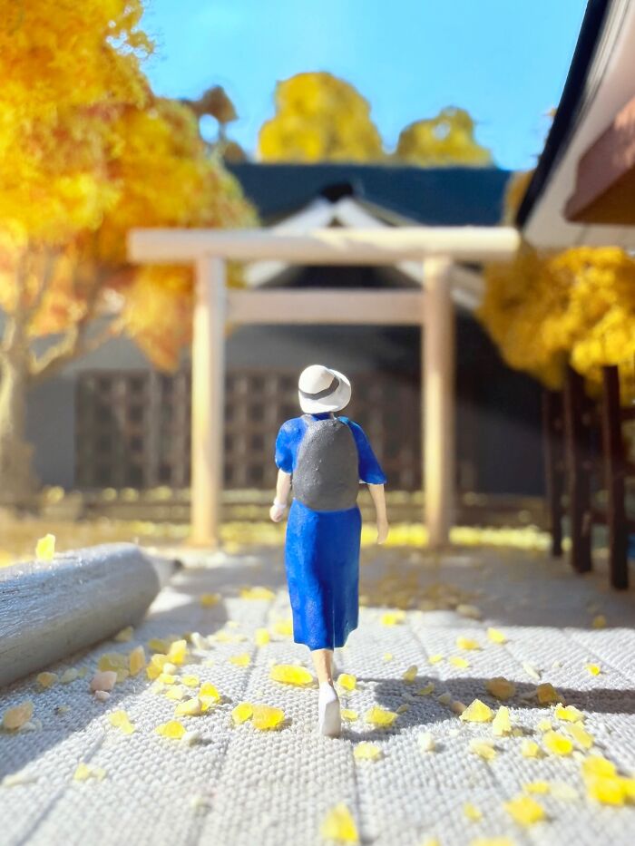 Artist Derrick Lin creates intricate diorama sets of a person walking through a torii gate in autumn.