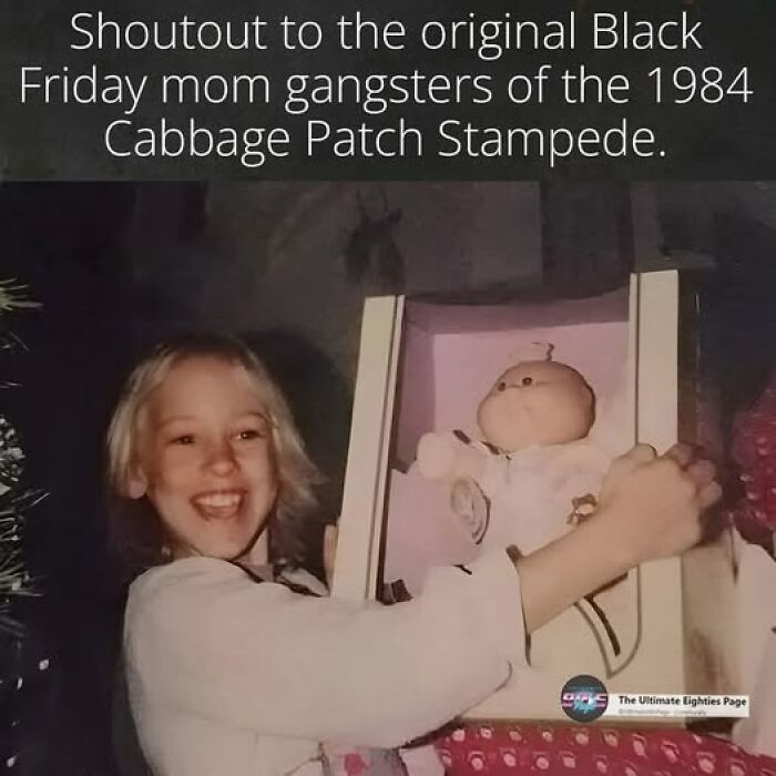 A young girl smiling with a Cabbage Patch doll. A Gen X meme about the 1984 Cabbage Patch stampede.