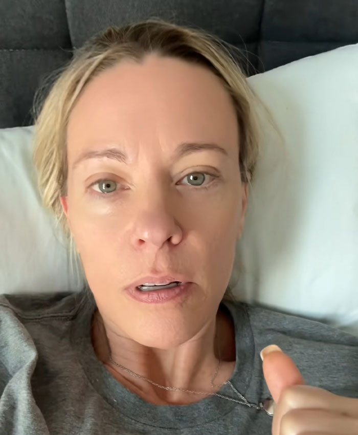 A close-up of a woman with light hair lying in bed, looking concerned, relating to Collin Gosselin's public battle.