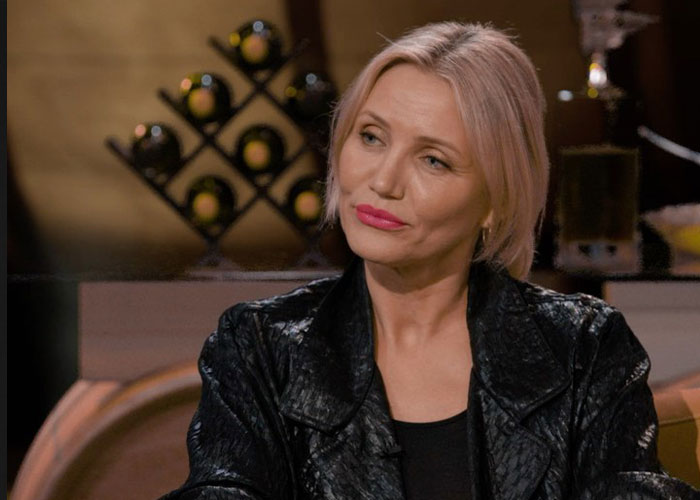 A woman with blonde hair and a black jacket looks contemplative, representing the personal price of fame for Jim Parsons. A woman with blonde hair and a black jacket looks contemplative, representing the personal price of fame for Jim Parsons.