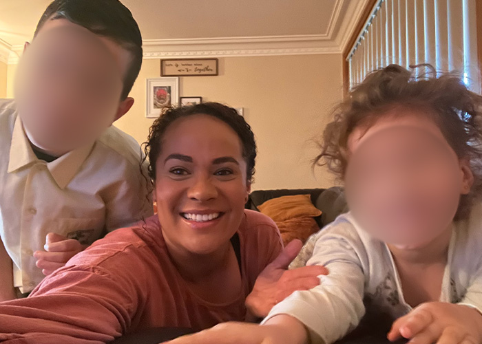 A mother smiling, surrounded by her kids, before the marshmallow accident where she loses her life.