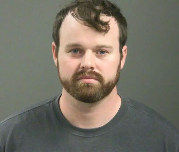 Josh Duggar mugshot, a reality star who committed serious crimes. He is one of the reality stars facing charges.