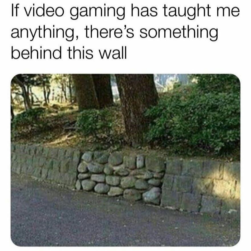 A section of a stone wall filled with loose rocks, hinting at a hidden path for '90s babies who loved gaming.