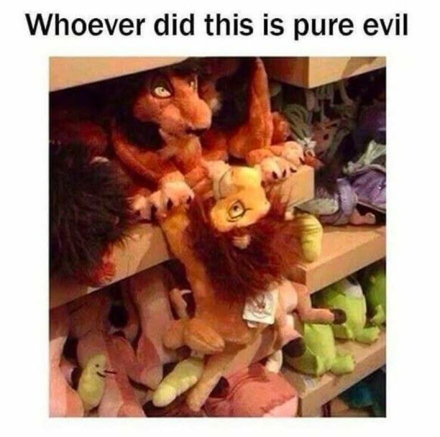 Mufasa plush toy from The Lion King hanging from a shelf by its paw, a funny memory for 90s babies.