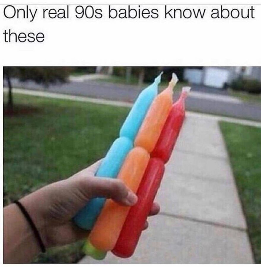 A hand holding several colorful freeze pops, a treat 90s babies remember too well from their childhood.