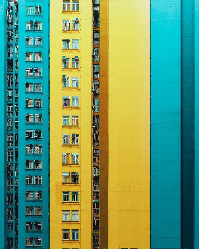 A vibrant architectural location showing a composed image of tall, colorful residential buildings in yellow and blue.