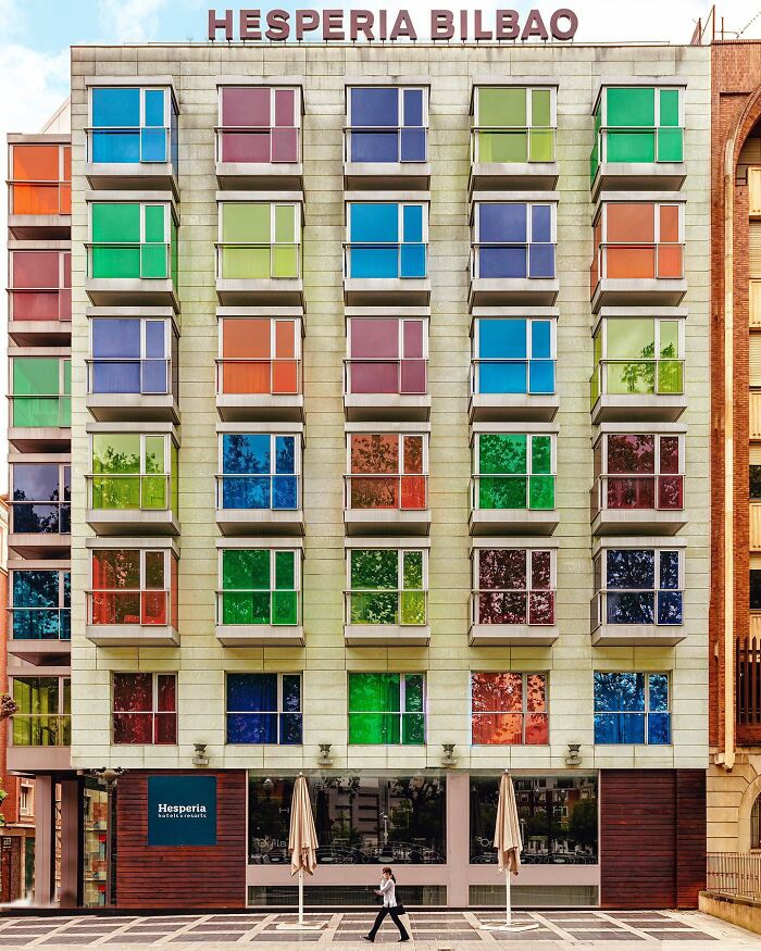 A photographer presents a perfectly composed image of the Hesperia Bilbao hotel, showcasing its colorful architectural locations.
