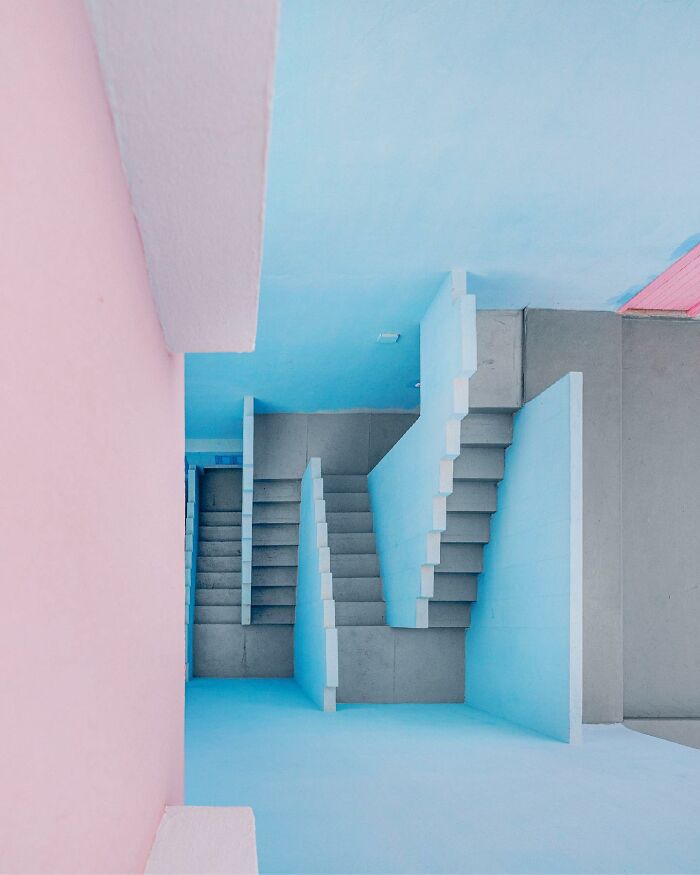 Architectural locations featuring pastel pink and blue walls, with grey concrete stairs.