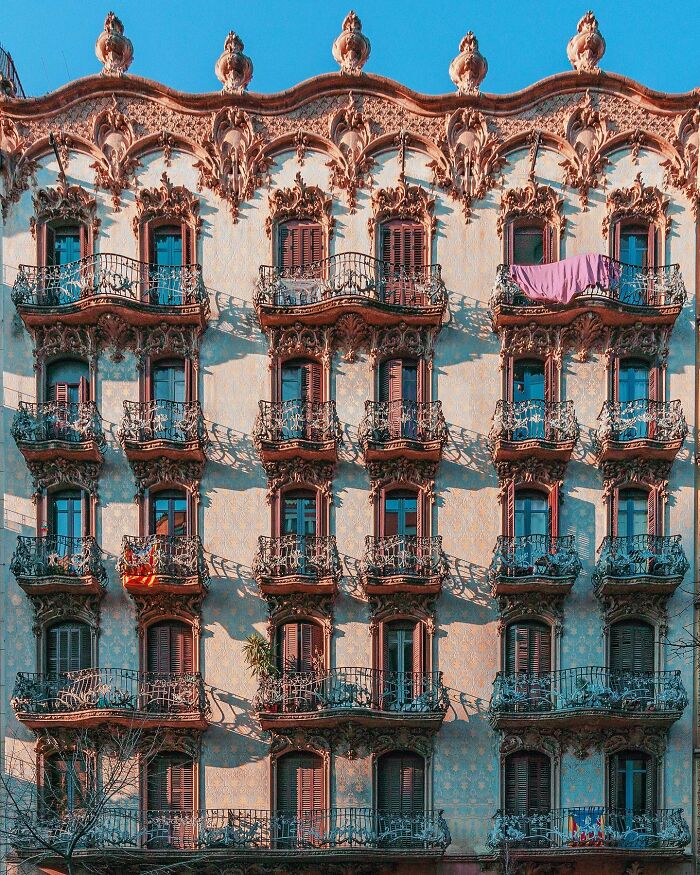 A detailed architectural location with ornate balconies and decorative facade, showcasing a composed image of the building.