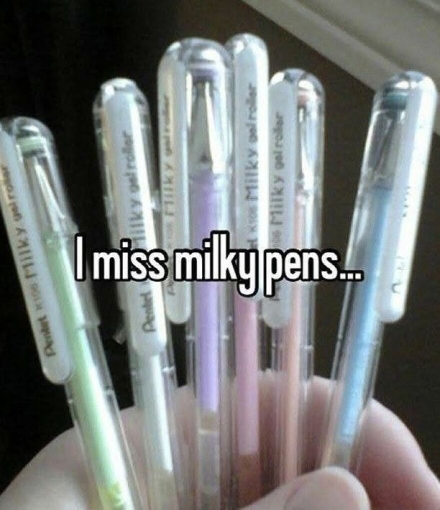 A hand holding several pastel Pentel Milky Gel Roller pens, a nostalgic item '90s babies might remember too well.