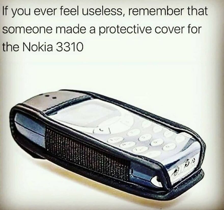 A Nokia 3310 phone inside a protective cover. A '90s babies meme about feeling useless.