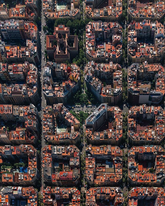 A photographer captures an aerial, perfectly composed image of dense architectural locations in a city.