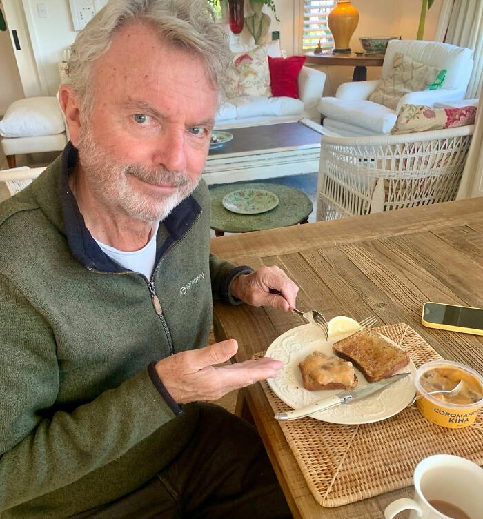Sam Neill at a table with breakfast, discussing pneumonia warning signs and his passing. Sam Neill at a table with breakfast, discussing pneumonia warning signs and his passing.