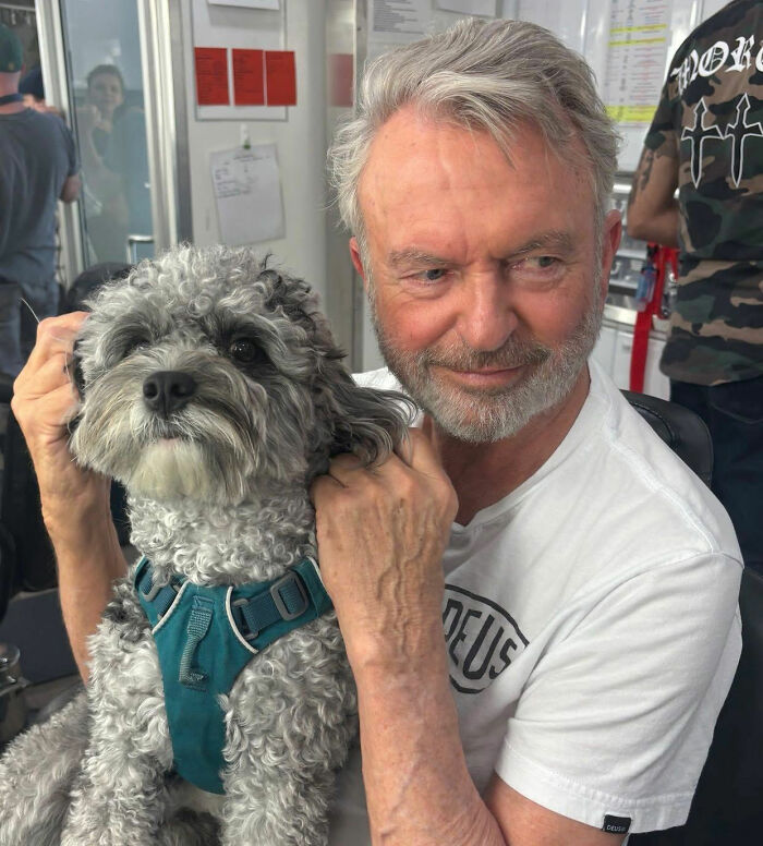 Sam Neill holding a small dog, reflecting on pneumonia warning signs and his passing. Sam Neill holding a small dog, reflecting on pneumonia warning signs and his passing.