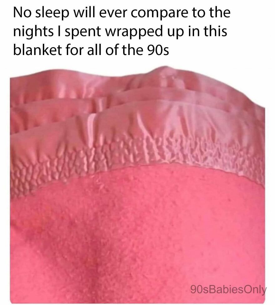A close-up of a pink textured blanket, providing comfort for '90s babies during the decade.