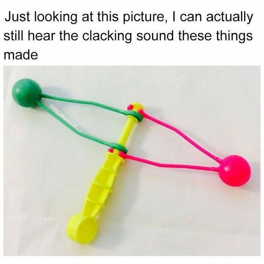 A colorful clacker toy with green and pink balls, a distinct sound '90s babies will recall.