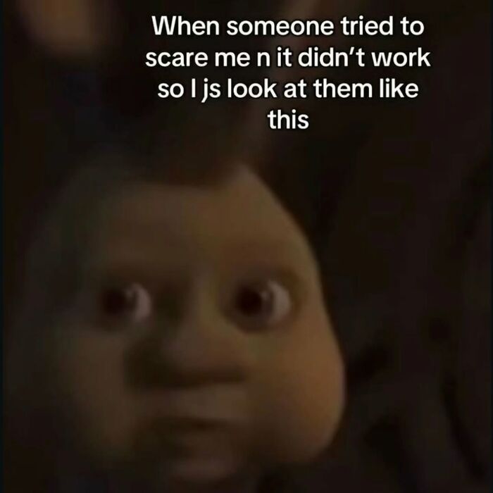 A relatable meme of a blurry-faced character from Shrek captioned: When someone tried to scare me n it didn't work so I js look at them like this.