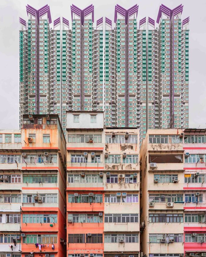 Architectural locations: old, worn buildings in the foreground contrasting with a modern, tall skyscraper behind them.