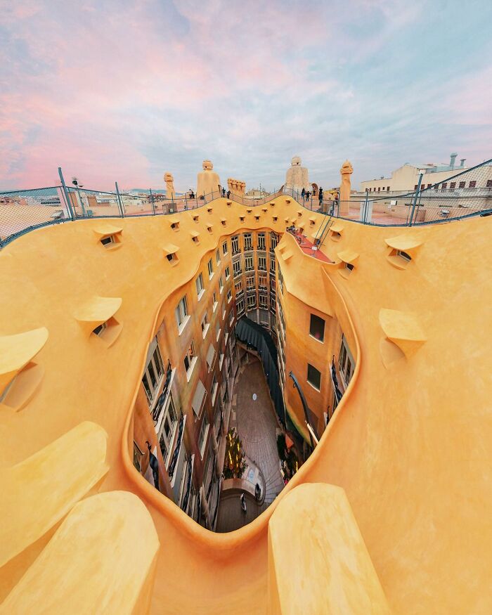 An aerial view from a unique rooftop showing a courtyard below, captured by a photographer for architectural locations.