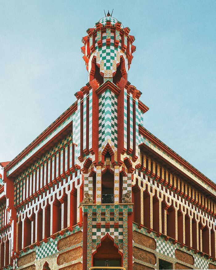 A photographer captures the vibrant, intricate architectural details of an old building, showcasing must-see architectural locations.