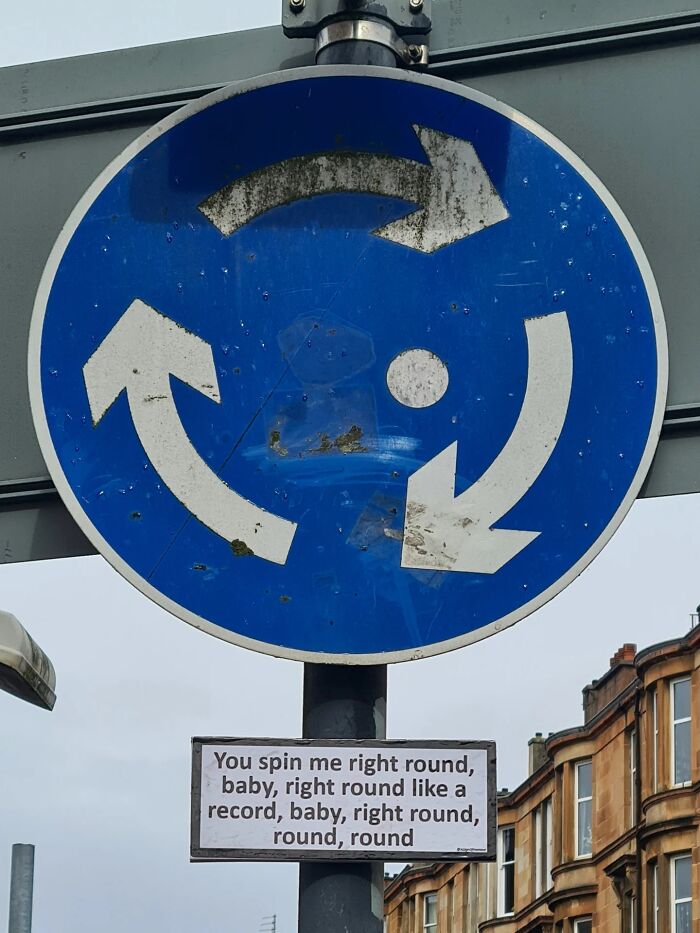 Absurd signs: A roundabout sign with song lyrics underneath about spinning right round like a record.