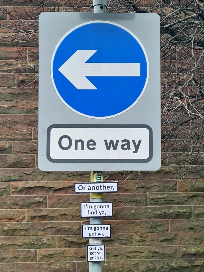 Absurd signs: A One Way sign with song lyrics about being found below it.