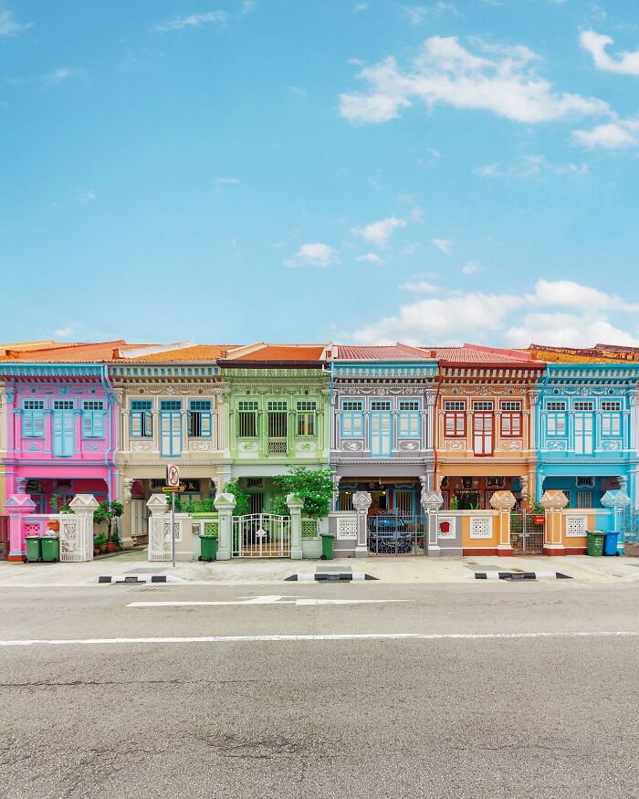 A photographer captures a perfectly composed image of a colorful row of architectural locations with ornate details.