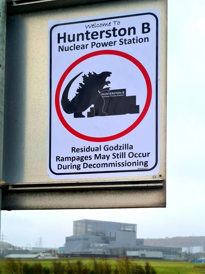 Absurd signs: A nuclear power station sign featuring Godzilla, warning of rampages during decommissioning.