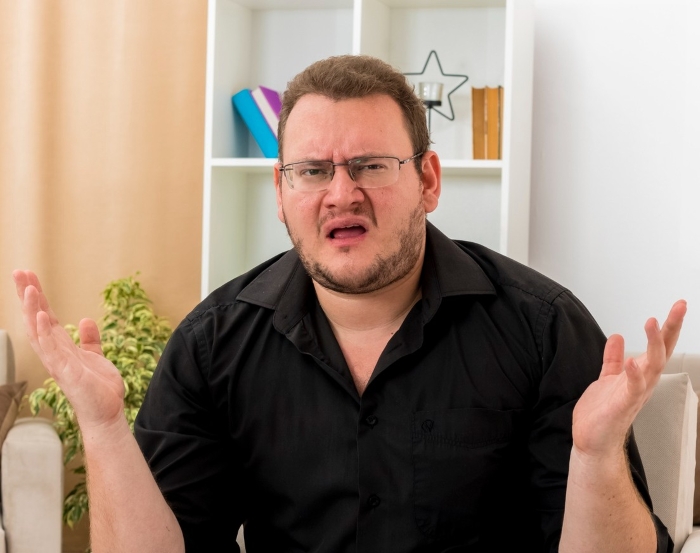 Man making a confused expression about the true crime story of what her BF did to her pan.