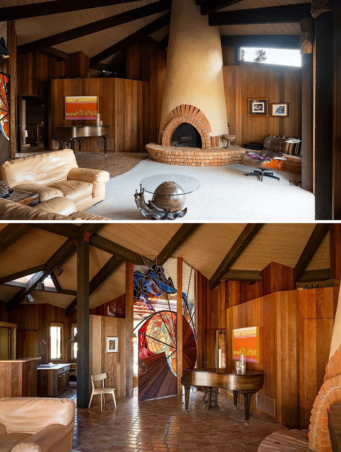 A multi-level living space featuring a large brick fireplace, wood paneling, and unique stained glass, typical of 1970s and 1980s interior design.