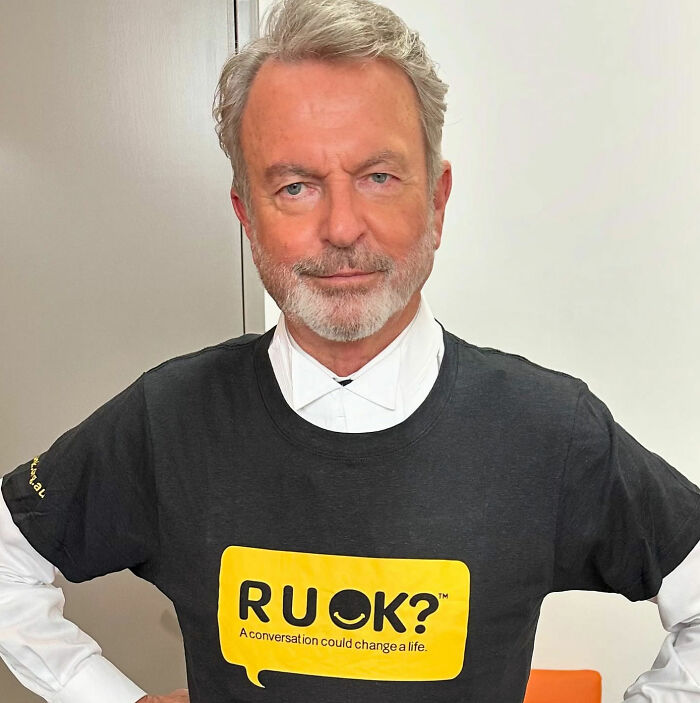 Sam Neill wearing a R U OK? t-shirt, highlighting pneumonia warning signs and his passing. Sam Neill wearing a R U OK? t-shirt, highlighting pneumonia warning signs and his passing.