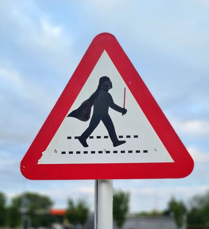 Absurd signs: A brilliant artist created a road sign depicting Darth Vader crossing the street.