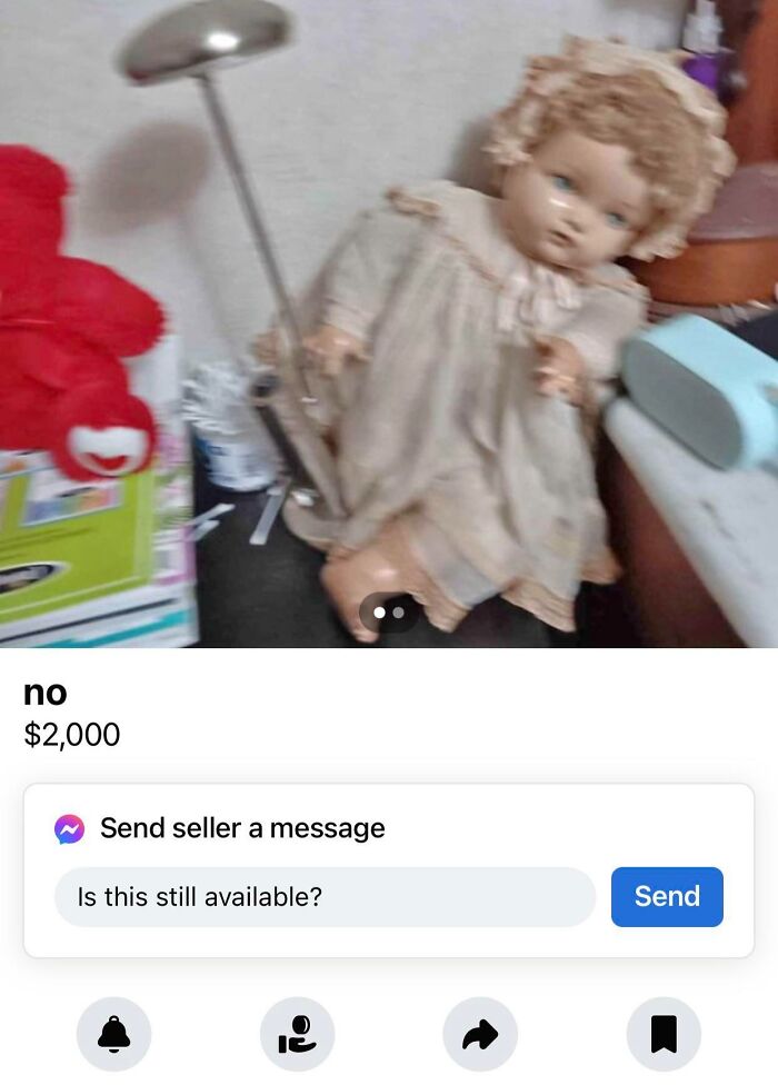 An unsettling antique doll with a broken leg, offered for sale in a strange marketplace listing.