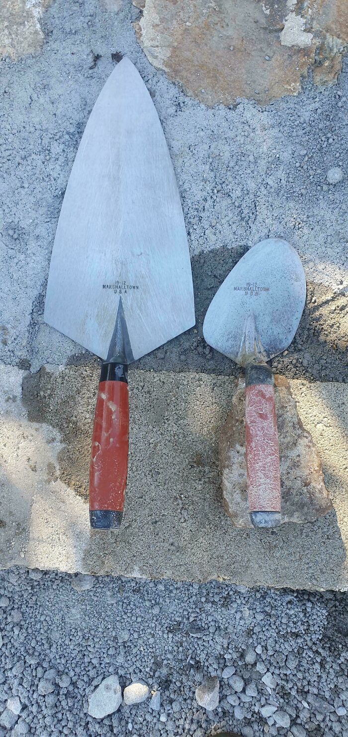 A before-and-after photo comparing two masonry trowels, showing interesting changes in wear and size.