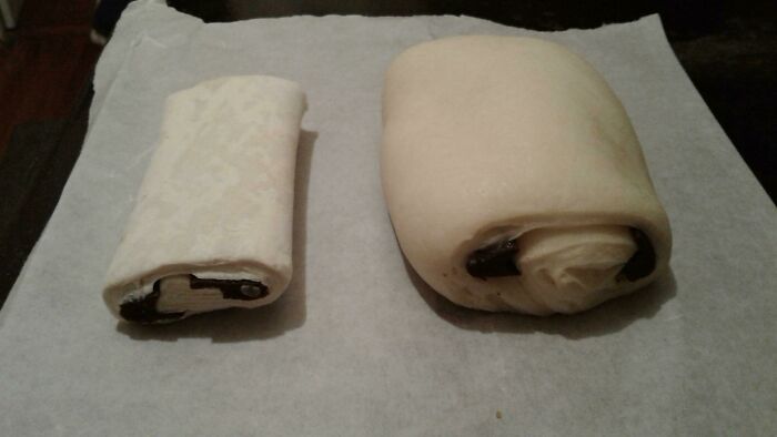 Chocolate croissants, one small and one large, displaying an interesting before-and-after proofing change.